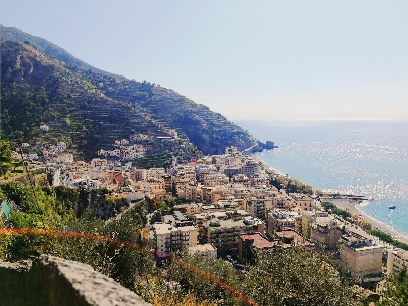 the charming seaside town of maiori in italy with a sunflare