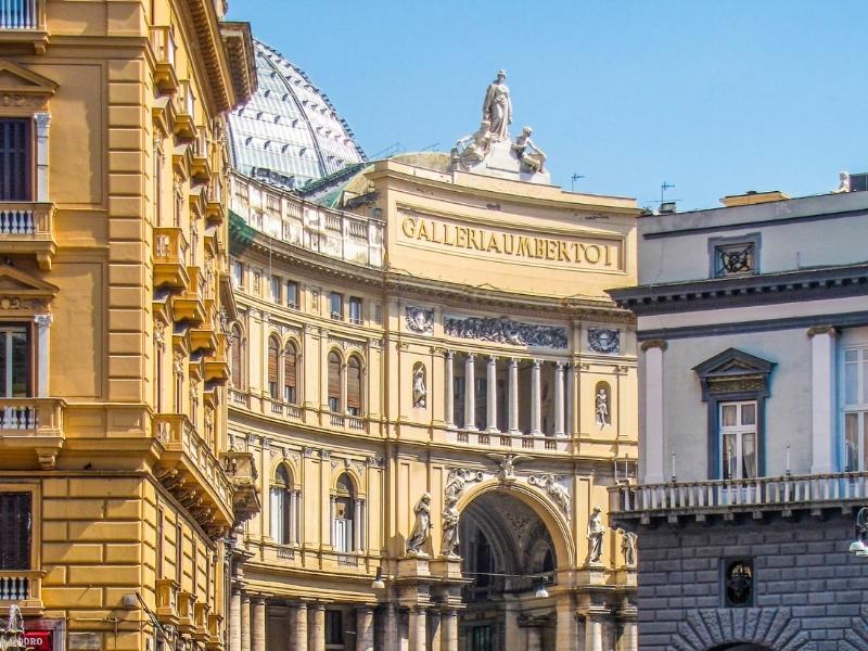 view of the city of Naples Italy with famous buildings in yellow and white color