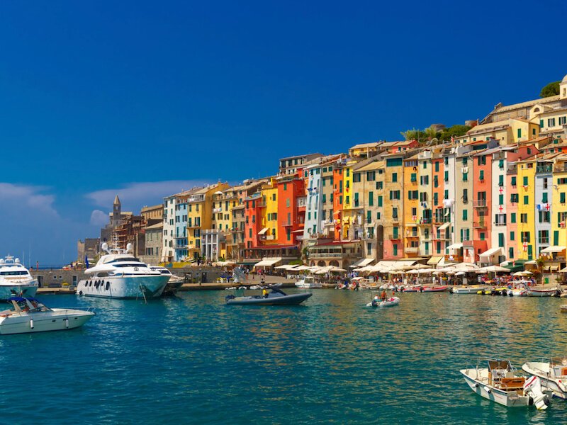The town of Porto Venere located near Cinque Terre as part of the Ligurian coast, more colorful houses on a harbor with boats