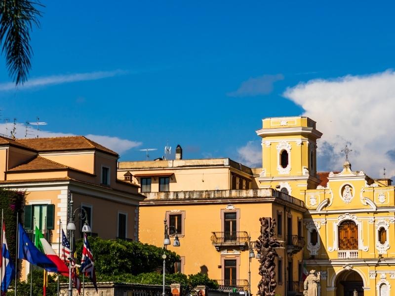 yellow buildings in the main plaza in sorrento italy