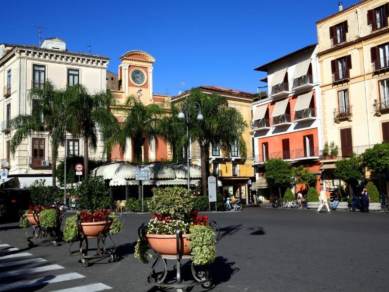 people walking around in the town of sorrento, italy north of the amalfi coast