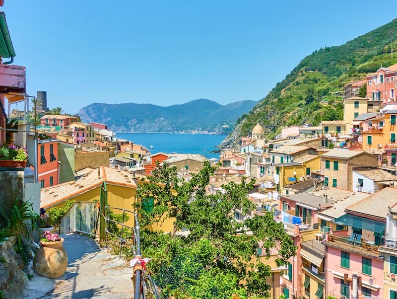 The town center of Vernazza in part of the cinque terre with blue water and colorful houses