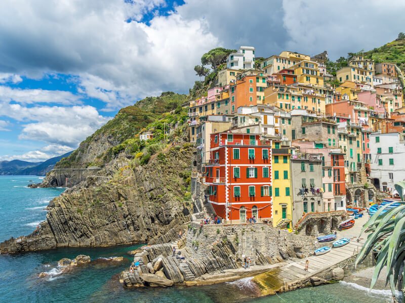 colors of many different buildings in riomaggiore and rocky cliffs