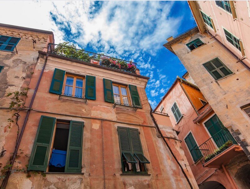 colorful houses with painted shutters in the town in monterosso al mare