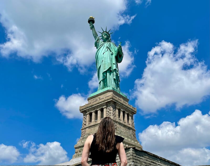 Allison in front of the statue of liberty