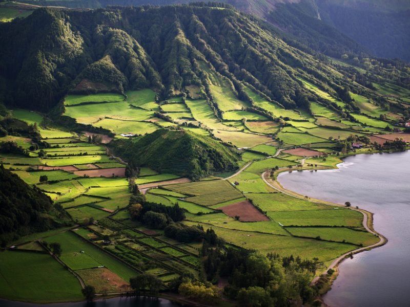 landscape of the azores islands with mountain, farmland and coastline
