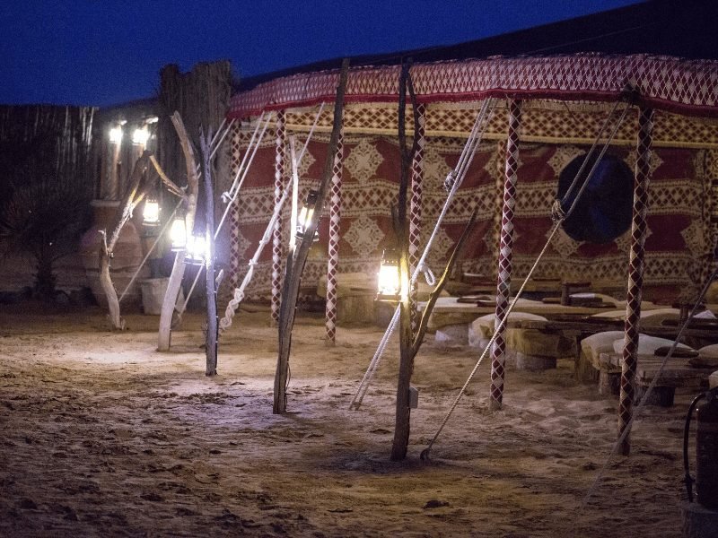 dining tent at a dubai desert camp site taken after dark