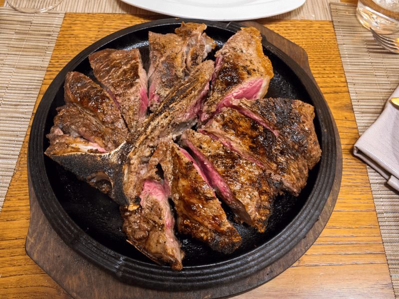 florentine steak cut to show beautiful rare cooking style