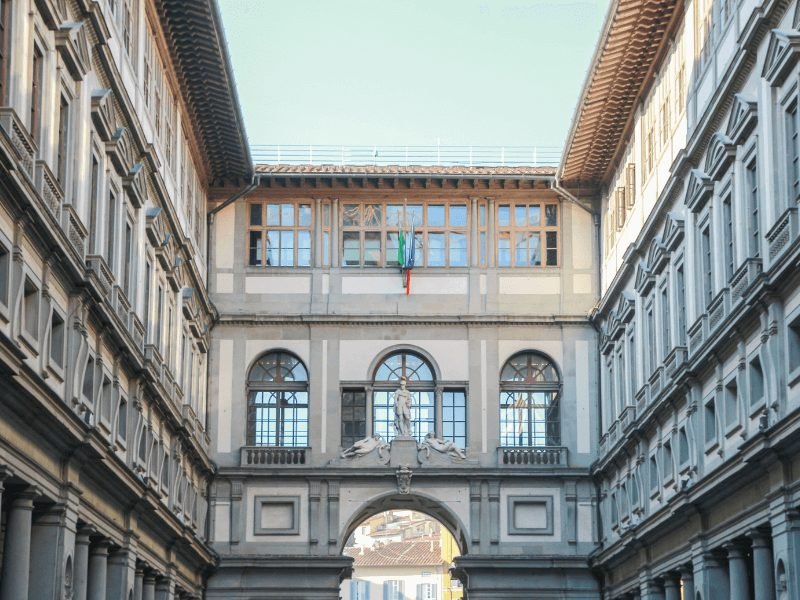 The courtyard of the decorative Uffizi Gallery of Florence with detail and beautiful arched windows in the courtyard