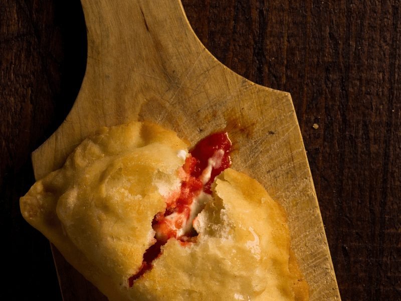 the famous dish panzerotti from puglia on a cutting board