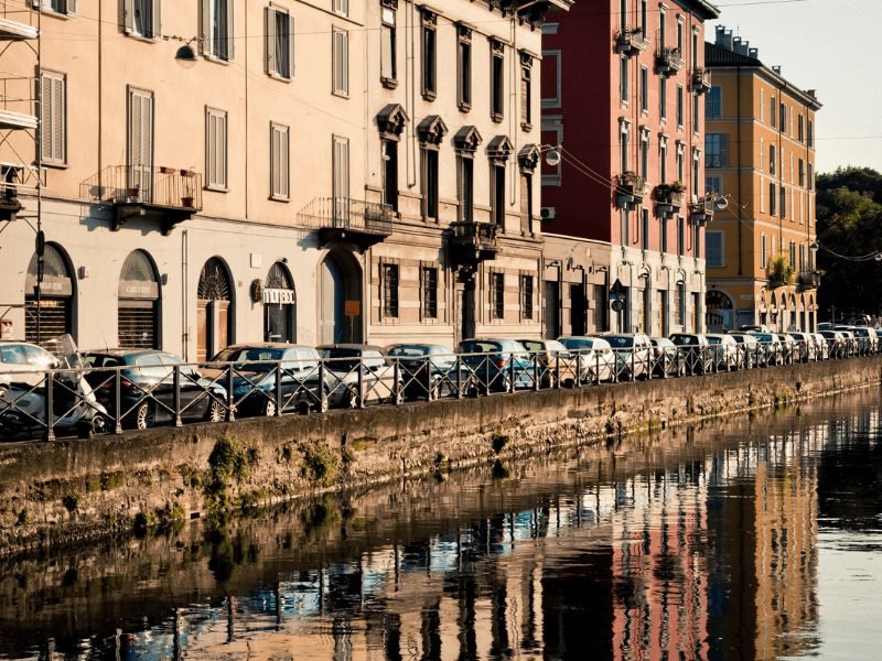 the canals of milan in the neighborhood called navigli with beautiful afternoon sunlight