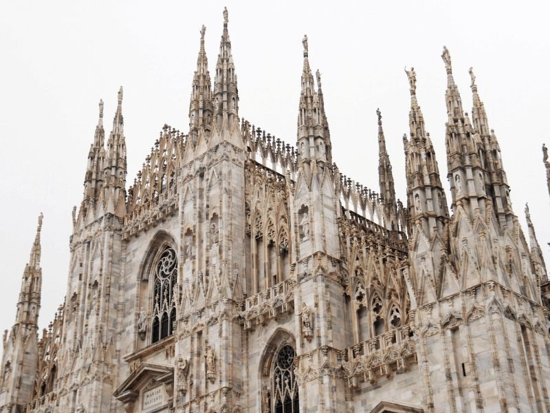 The many spires of the Milan Duomo, one of the most famous landmarks of Milan, with an ornate marble facade