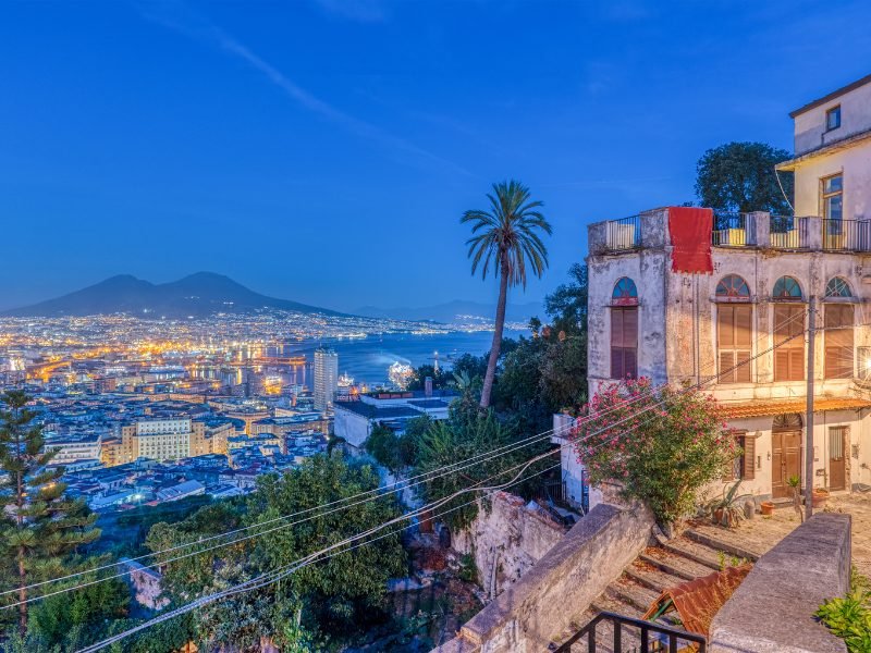 naples italy at night with trees, lights, view over the sea and mountains in vomero district