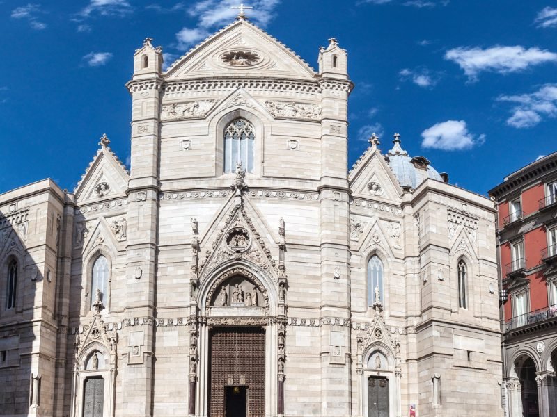 cathedral of naples with white facade and details