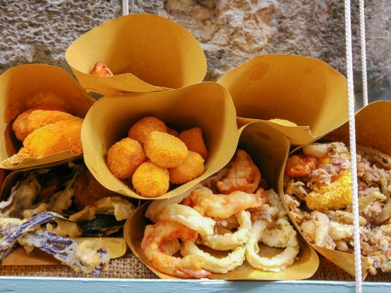 tasty cones filled with fried treats that are common street foods in naples