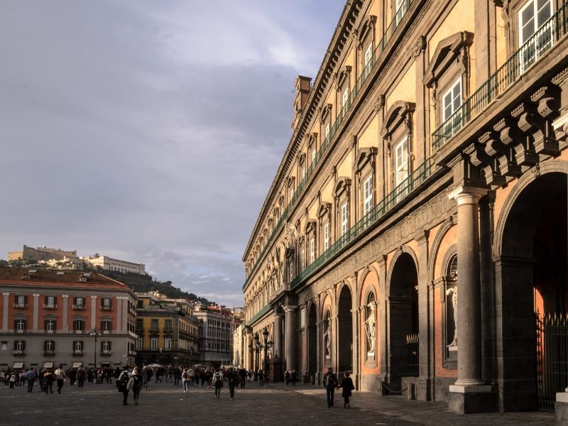 a view in a naples city center with shadow casting over a piazza