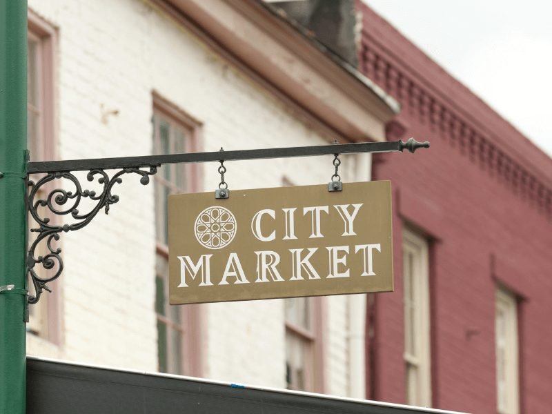 sign that reads city market outside of savannah shops