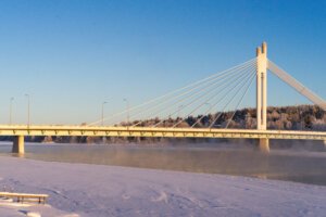 Bridge in Rovaniemi city center with iced over river