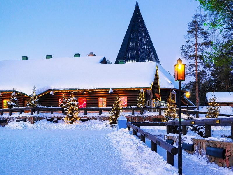 santa claus village in the blue light after the sun has set in rovaniemi in winter