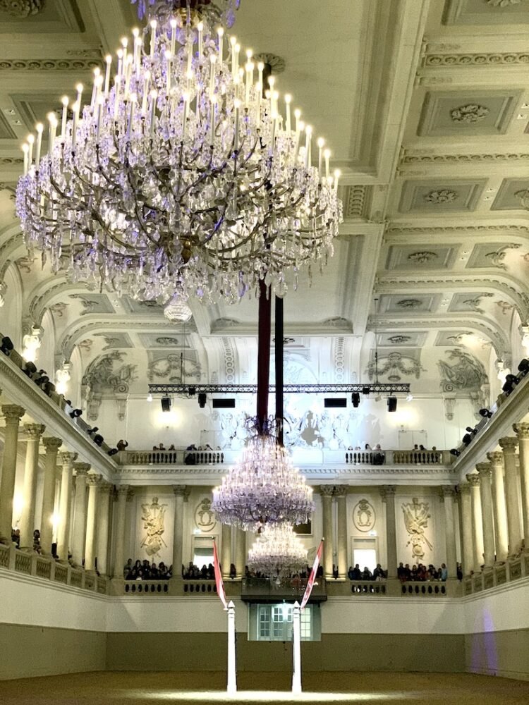 Close up of the chandeliers and ceiling of the Spanish Riding School before a performance