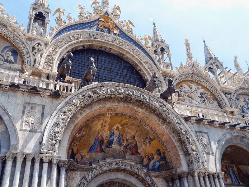 The ornate decoration at the entrance of St. Mark's Basilica in St. Marks' Square, the heart of Venice city center.