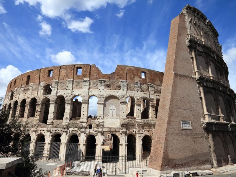 exterior of the colosseum with arches and in tact architecture