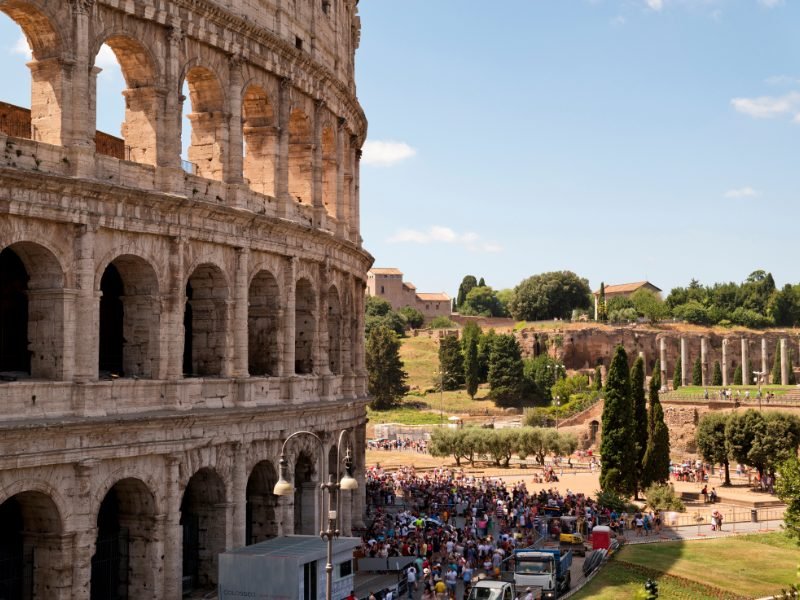 lots of tourists outside the colosseum in rome