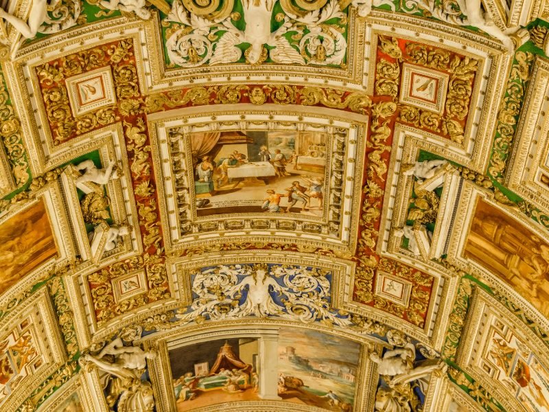 an ornately painted ceiling in the vatican museums in rome