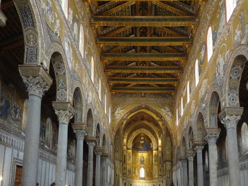 ornate arches and interior of the arab norman church with unique architectural detailing like archways (arab influence) and gold (byzantine influence)