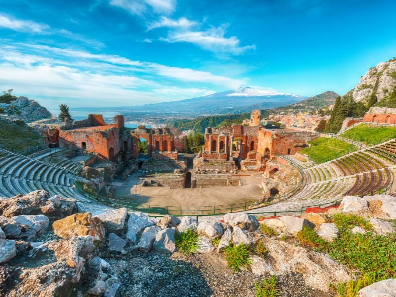 amphitheater near taormina with view of etna in the distance