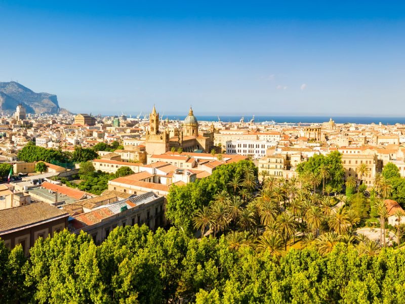 view of palermo italy from above taken with a drone showing mountain, city and sea