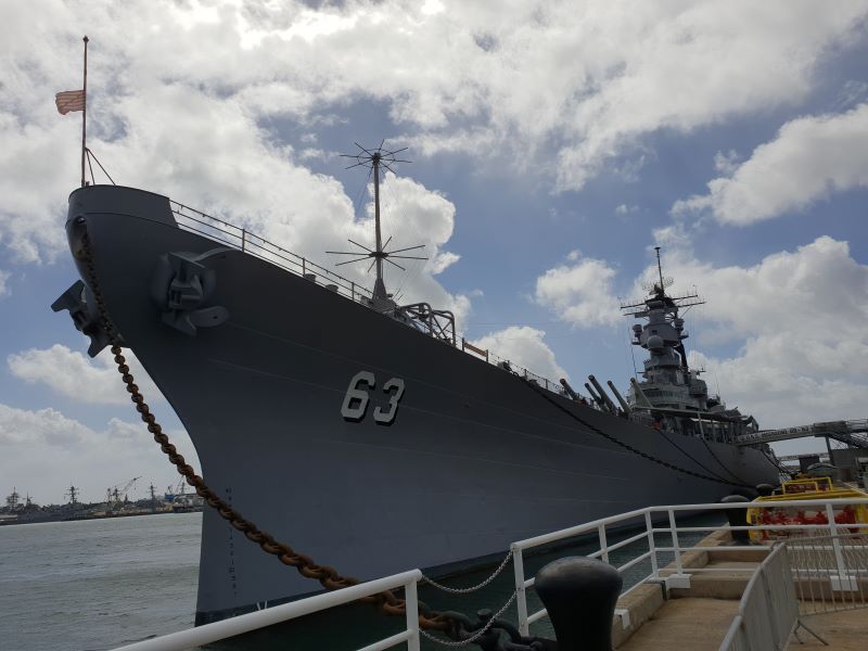 ship at pearl harbor on a partly cloudy day in oahu