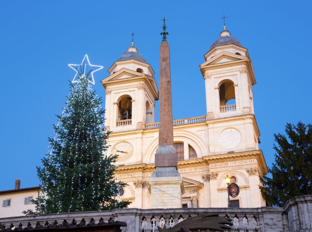 christmas tree in front of the monti church at the top of the spanish steps in rome