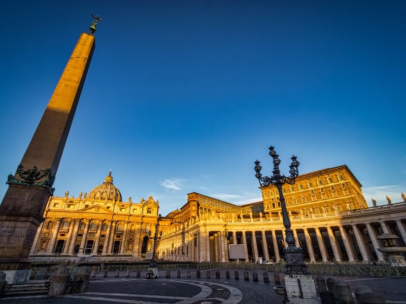 early morning close to sunrise in the vatican with sunlight falling on the buildings