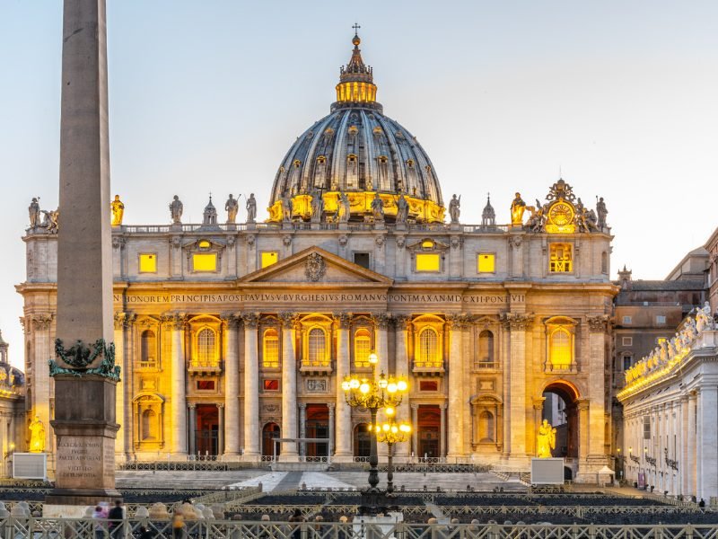 view of the st peter basilica lit up at night ready for nighttime visitors