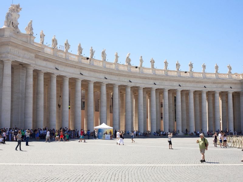 st peters square with a small crowd of people around it
