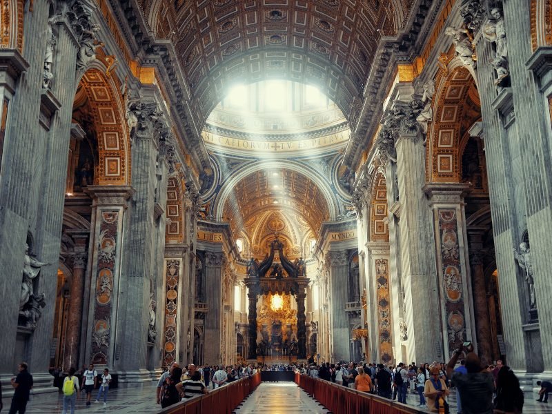 a light beam coming down from the skylight in the st peters basilica in vatican city