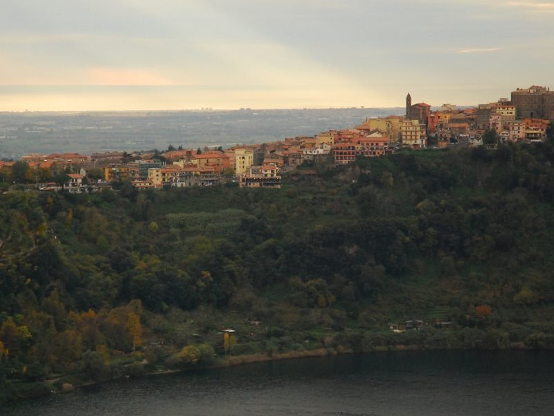 village of nemi near rome, a hillside town with colorful buildings on the edge of a hill