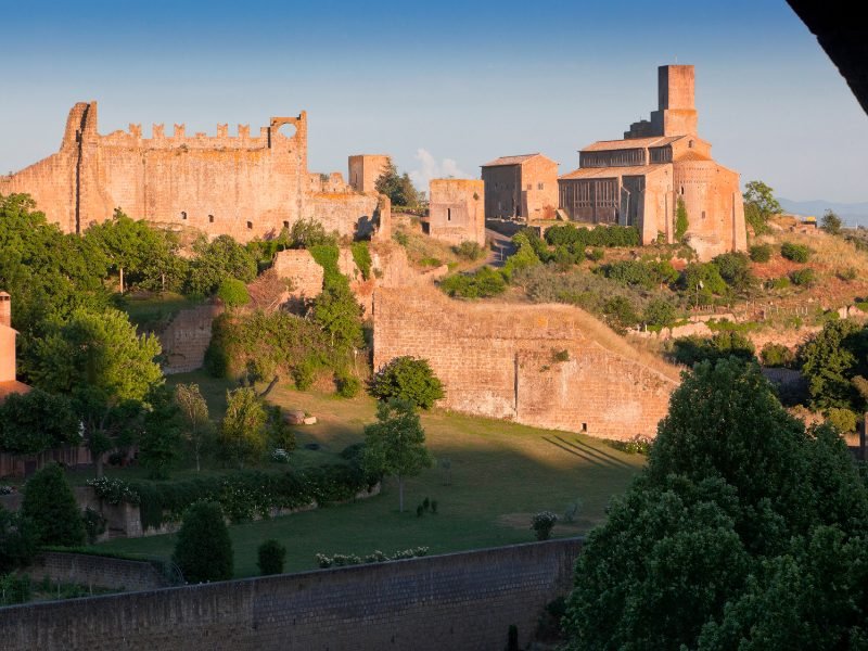 light falling on a castle looking fortress area with fortified walls in viterbo a beautiful day trip from Rome