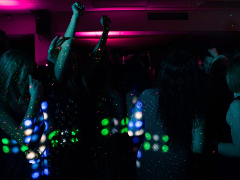 anonymous people dancing in a club in rome, italy
