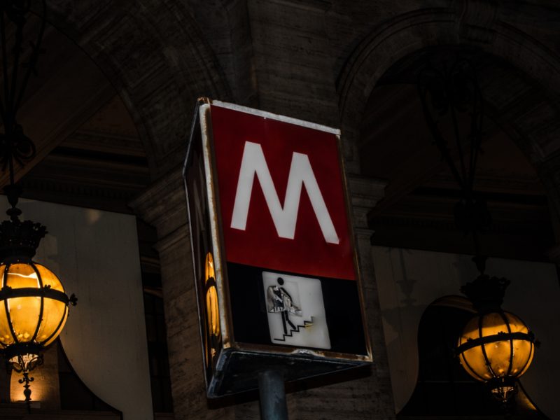 metro sign at night in rome