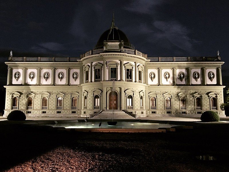 The ariana museum all lit up at night in the winter in switzerland's city of geneva