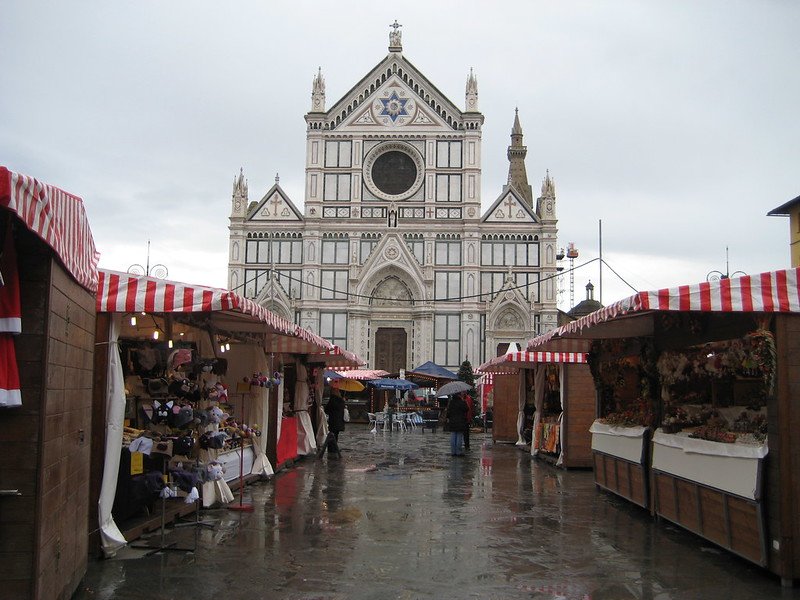 Christmas market with German style stalls in the Santa Croce plaza in florence in winter