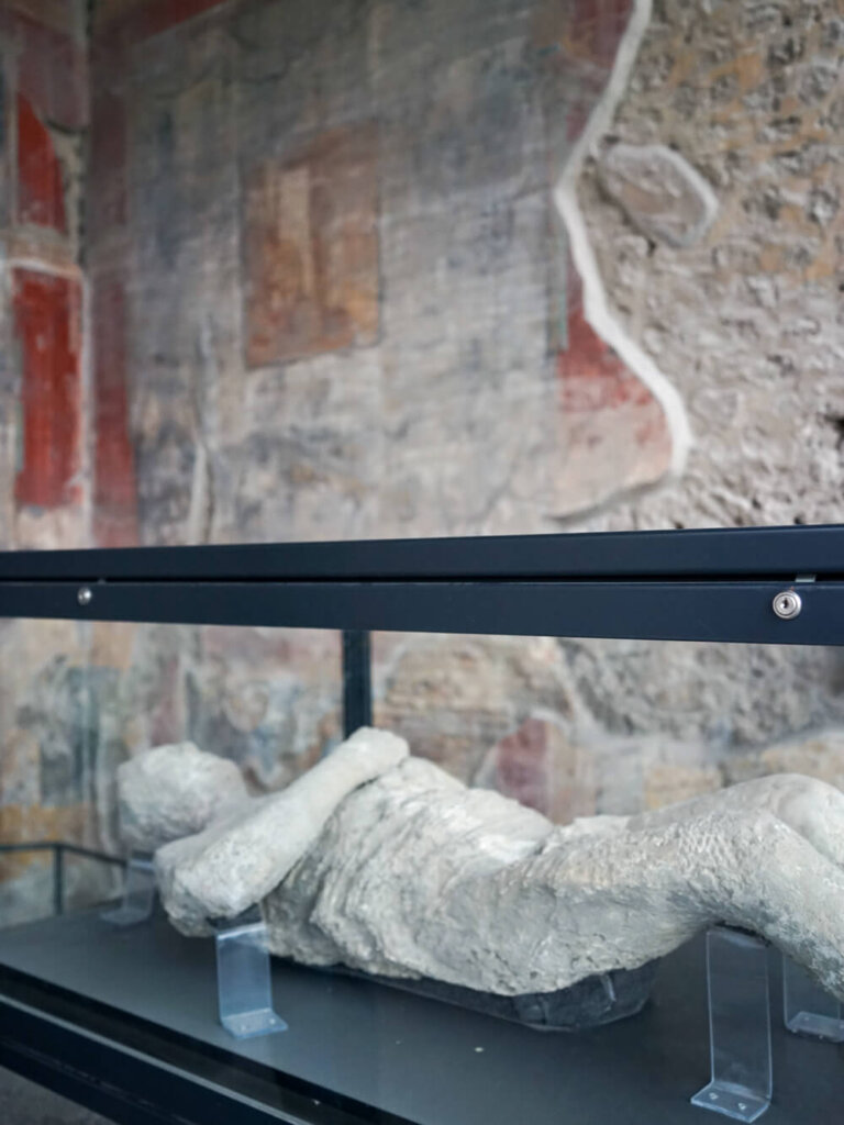 View of one of the plaster casts of a person found in the Pompeii ruins, preserving their body like a mummy