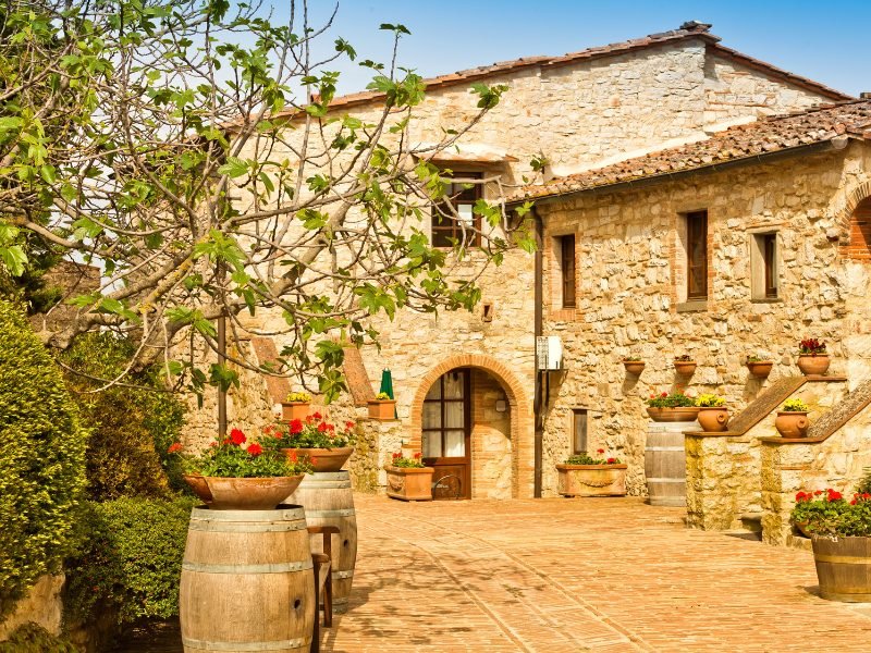 winery in Tuscany italy with flowers and stone house