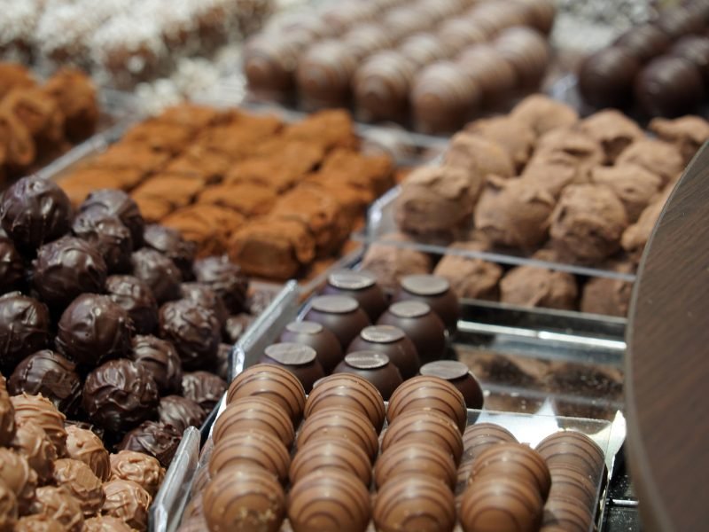 chocolates in a Swiss chocolate shop piled up for tasting on a chocolate tour in geneva in winter