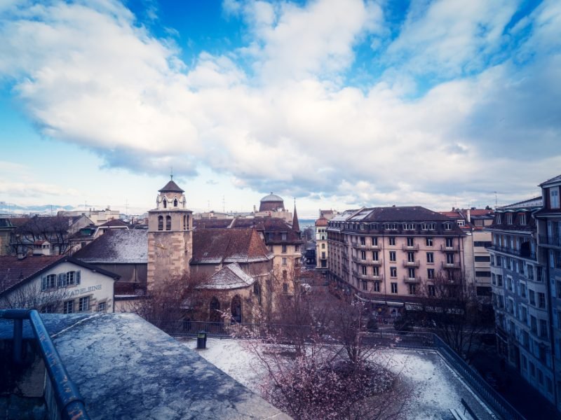 view of snowfall in Geneva from a rooftop looking onto the old town