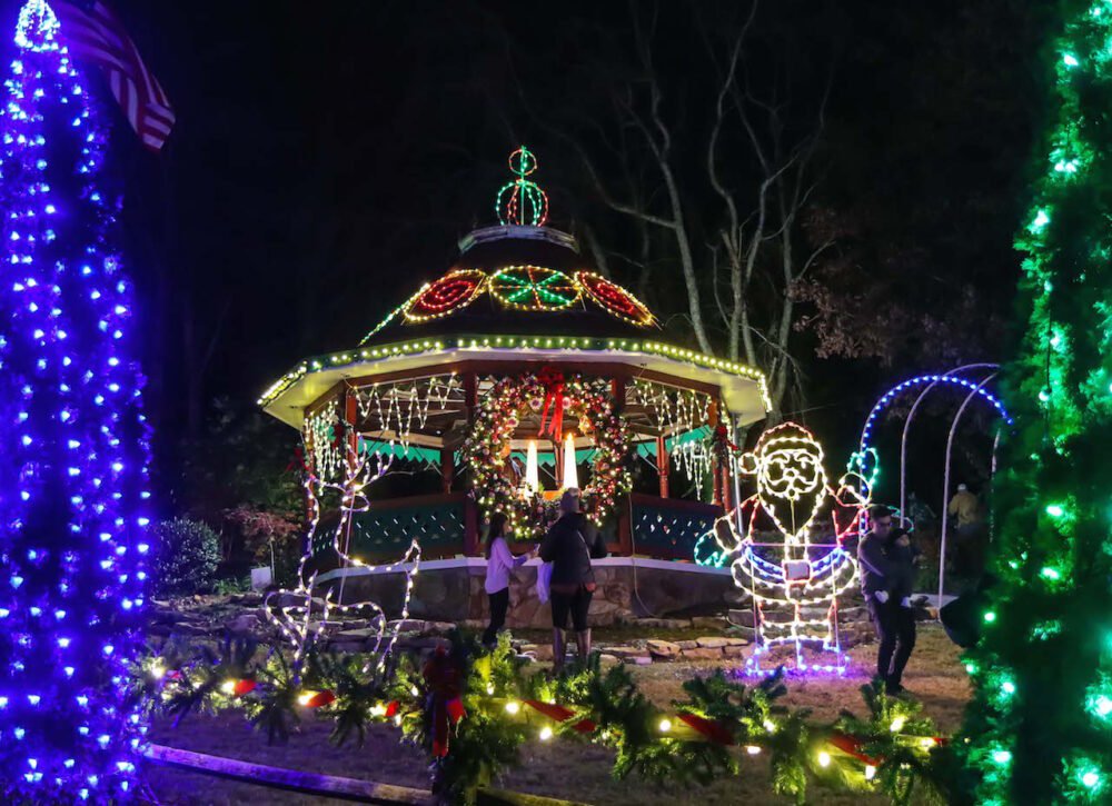 Santa Claus lights and lit-up gazebo with Christmas wreath in Helen, GA in December