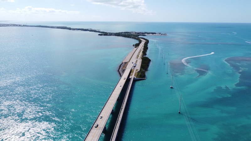 Drone photo of the highway to the Keys in Florida with beautiful blue water underneath the highway