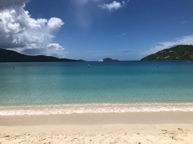 The clear waters of Magens Bay in Saint Thomas of the US Virgin Islands with mountains in the distance on the horizon